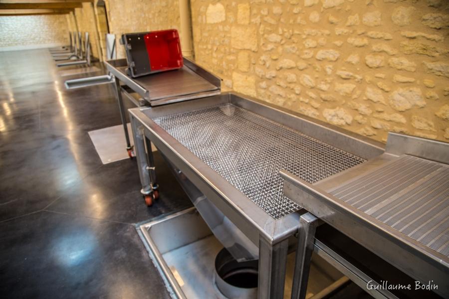 Fully manual sorting system eliminates electricity for the health of the employees and improves the energy in the cellar. With the same number of people as before, the manual brewing and manual picking is as effective as before. – at Chateau Pontet-Canet.